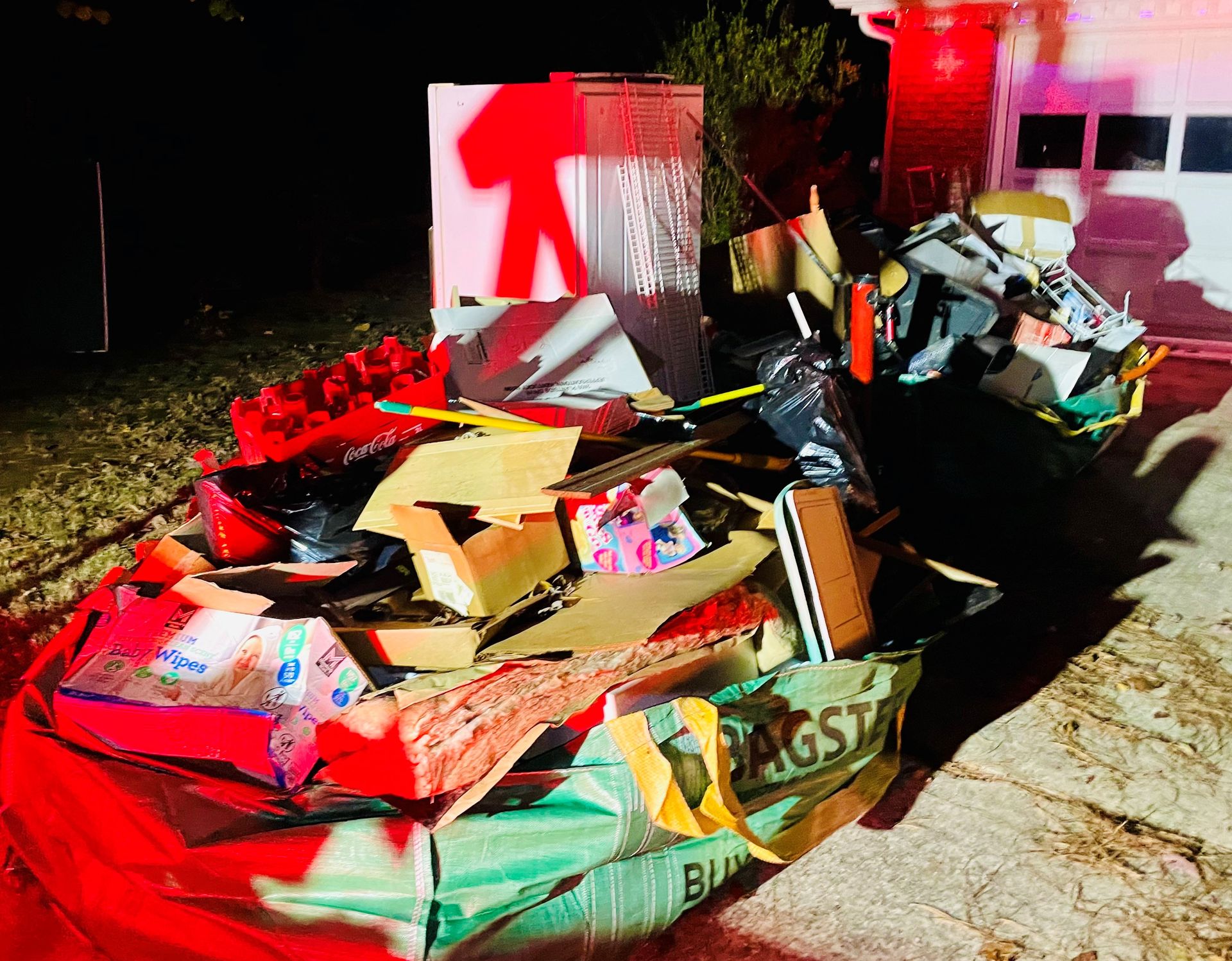 Full 3-yard dumpster bag Dumpster bag full of debris ready for pick up