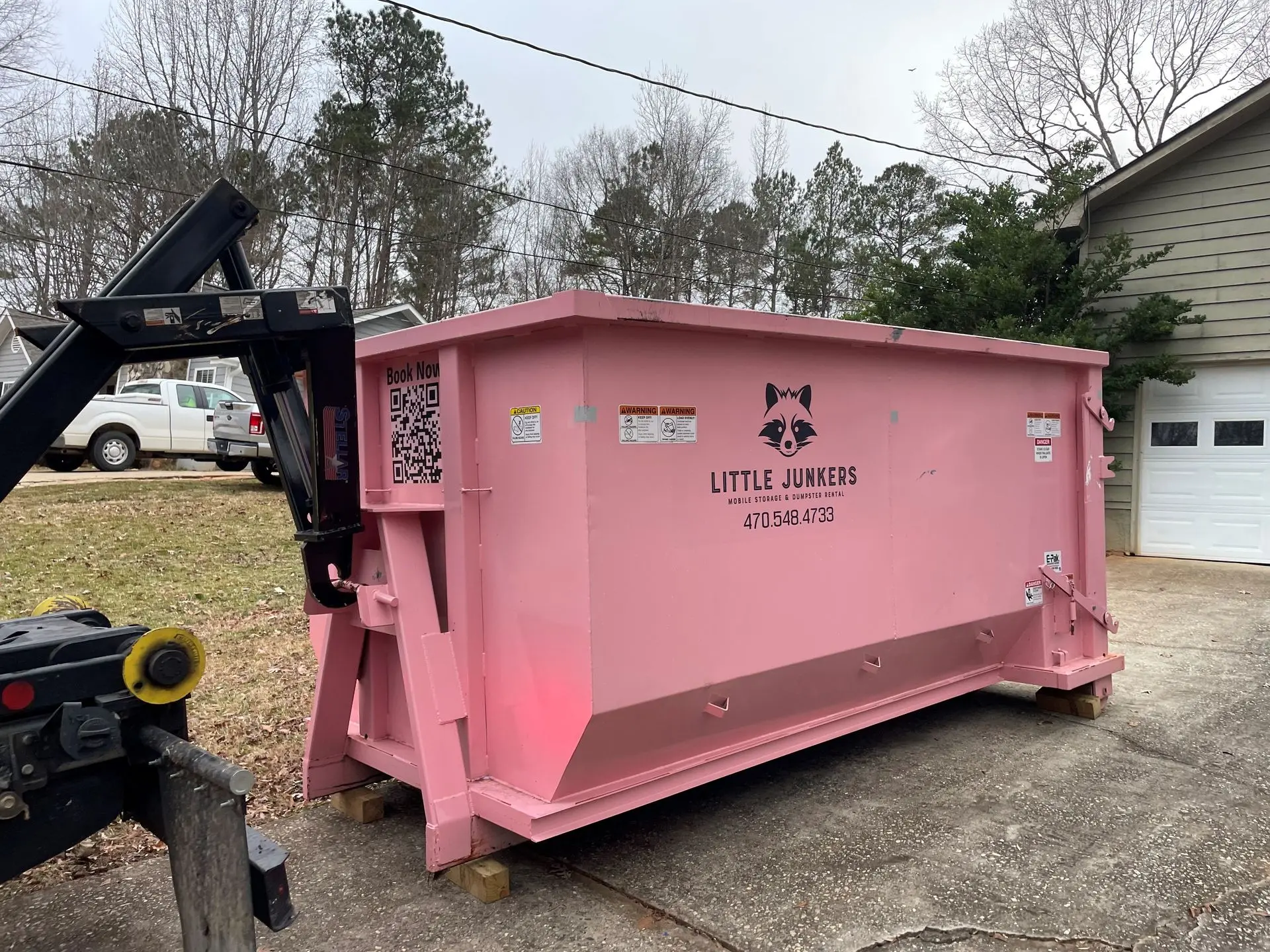 Pretty in pink! This Little Junkers dumpster is ready for your next clean-up project. #junkremoval #pinkdumpster