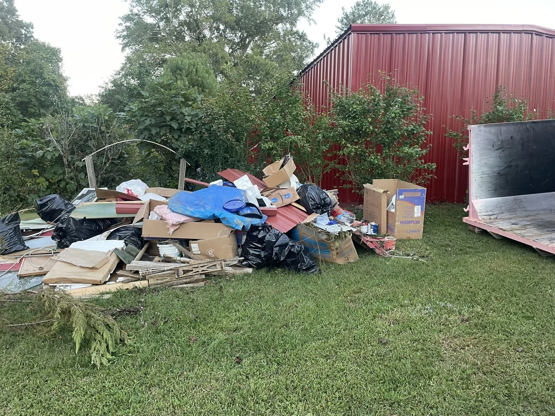 Trash pile outside of a 16 yard dumpster in South Fulton Ga