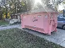16 Yard dumpster in driveway