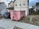 16 yard dumpster with car
